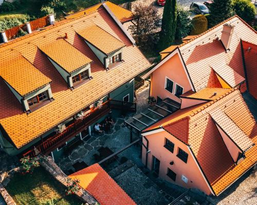 an overhead view of roofs of houses with a train at Penzion Tilia in Český Krumlov