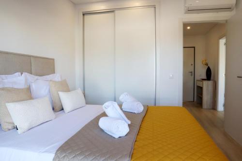 Postel nebo postele na pokoji v ubytování Rocha Premium by ALgest