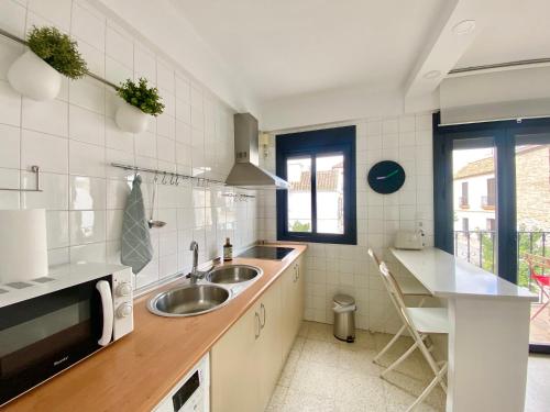 a kitchen with a sink and a counter at Dúplex Centro Écija in Écija