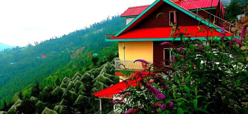 a house with a red roof on top of a mountain at Mountain View New Kufri in Cheog