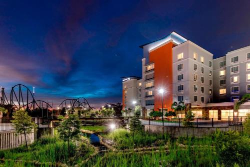 a rendering of a building at night at TownePlace Suites by Marriott Orlando at SeaWorld in Orlando