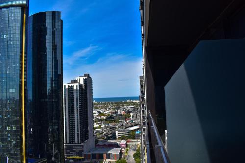 a city view of a city with tall buildings at Deluxe 3 Bedroom Apartment in Southbank in Melbourne
