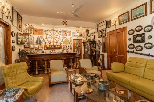 a living room filled with furniture and a piano at Anchorage 42 in Chandīgarh