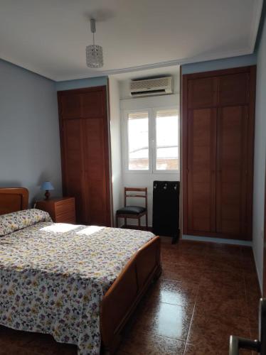 a bedroom with a bed and a window at Reina Amalia in Quintanar de la Orden