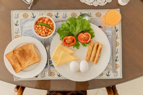 a plate of food with eggs and vegetables on a table at Anchorage 42 in Chandīgarh