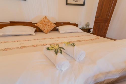 a bedroom with two beds with towels on them at Anchorage 42 in Chandīgarh