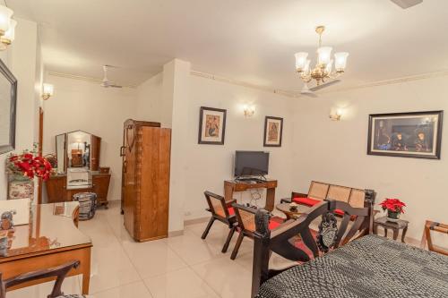 a living room with a table and a dining room at Anchorage 42 in Chandīgarh