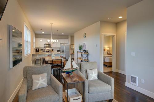 a living room with two chairs and a table at Willowbridge Cottage in Ocean Shores