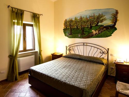 Ένα ή περισσότερα κρεβάτια σε δωμάτιο στο Agriturismo Ferrari