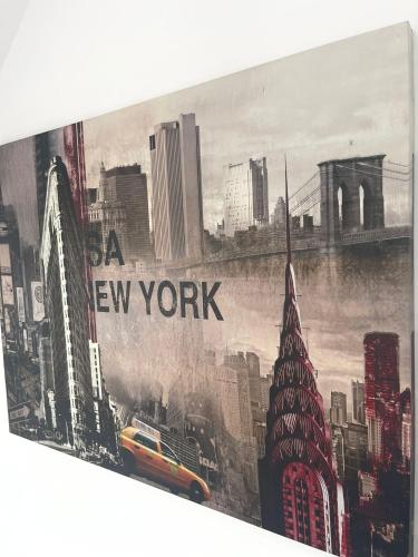 a picture of a city with the words new york at ROYAL APARTMENTS in Lunca de Sus