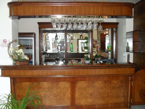 a wooden bar with a mirror behind it at Motel Hanat in St. St. Constantine and Helena