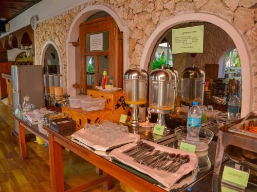 a kitchen with a counter with some food on it at Best Western Jangwani Sea Breeze Resort in Dar es Salaam