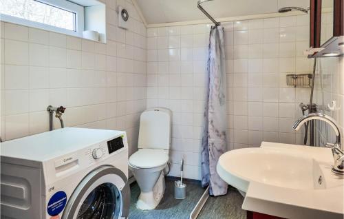a washing machine in a bathroom with a sink at 2 Bedroom Stunning Apartment In Skrhamn in Klövedal