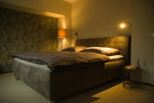 a bedroom with a large bed with two pillows at Apartment Henriette in Oranienbaum-Wörlitz