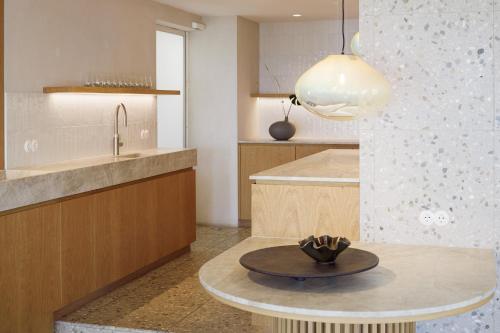 a kitchen with a table with a bowl on it at Hotel Haus am See in Nonnenhorn