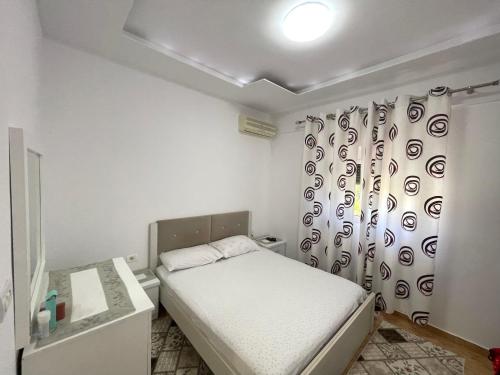 Katil atau katil-katil dalam bilik di Luigi s Fairyview Apartment