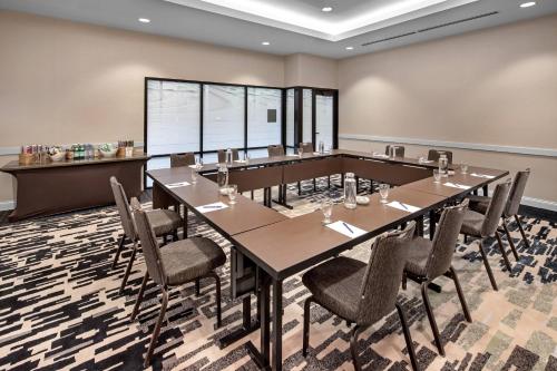 a conference room with a long table and chairs at Delta Hotels by Marriott Minneapolis Northeast in Minneapolis