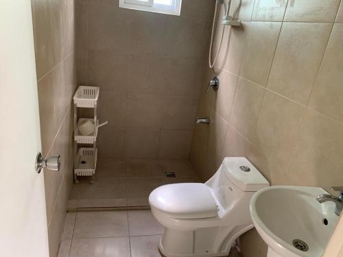 a small bathroom with a toilet and a sink at 3 bed 3 bath Friendly, Friendship area, Fibre bdb in Angeles