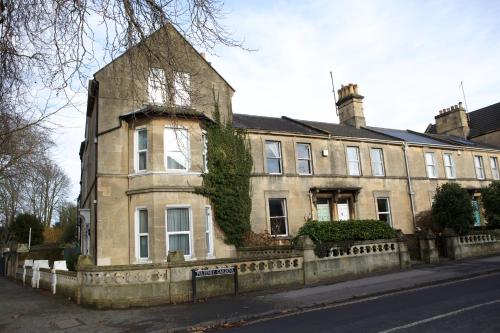 an old house on the side of a street at Avon Guesthouse in Bath