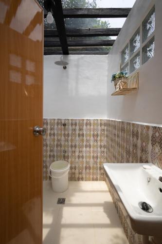 a bathroom with a sink and a toilet at Relaxing Lake side Staycation for Family ,2 to 3 hours away from Manila in Cavinti