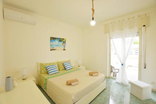 Villa Sud Sicily tesisinde bir odada yatak veya yataklar