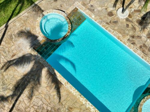 an overhead view of a blue swimming pool at Zula Zanzibar in Paje