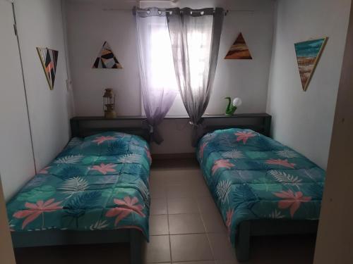 Posteľ alebo postele v izbe v ubytovaní Maison de vacances, découvrir le sud de la Réunion