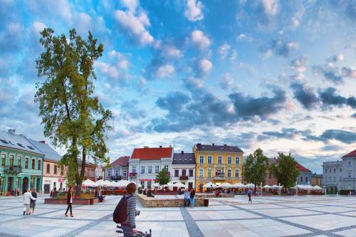 a group of people walking around a city square at ONRest Hostel Centrum Żytnia 8 FaktVat in Kielce