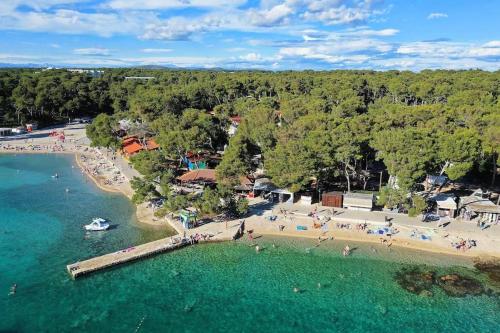 an aerial view of a beach with people in the water at Mobile Home La Vida in Biograd na Moru