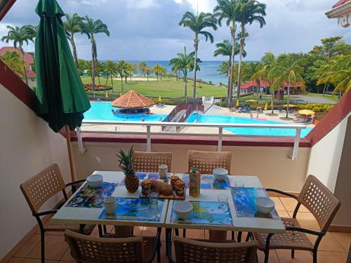 A view of the pool at Appartement Madinina 6 personnes vue sur mer dans village vacances or nearby