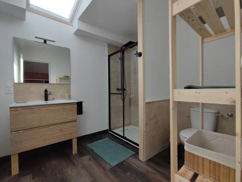 a bathroom with a sink and a shower and a toilet at Gîte Sud Ardèche in Vinezac