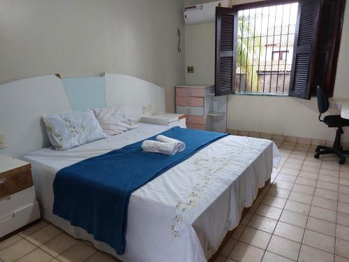 מיטה או מיטות בחדר ב-Cumbuco - Casa de praia com piscina e deck