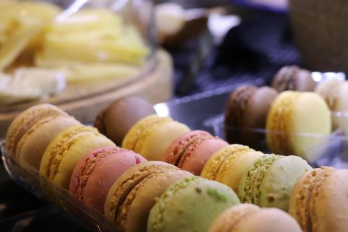 a bunch of donuts are lined up on a table at Juliana Hotel Cannes in Cannes