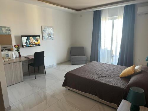 TV a/nebo společenská místnost v ubytování Seaside Accomodation