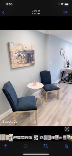 a living room with two chairs and a table at Beautiful master bedroom with private bathroom in Baltimore