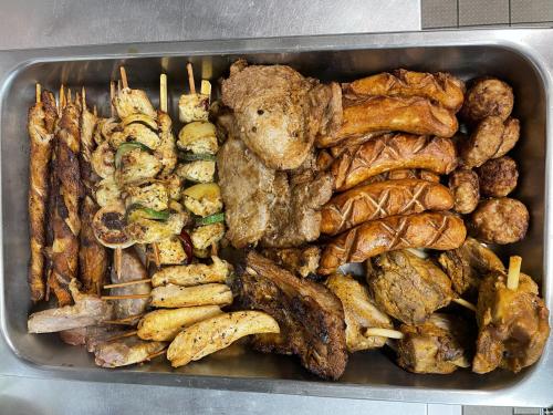 a tray of food with meat and other foods at Lausitzstube in Kurort Altenberg