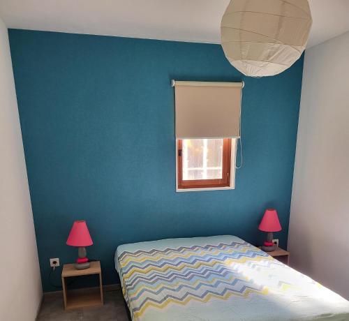 Ένα ή περισσότερα κρεβάτια σε δωμάτιο στο Le nid’Ange