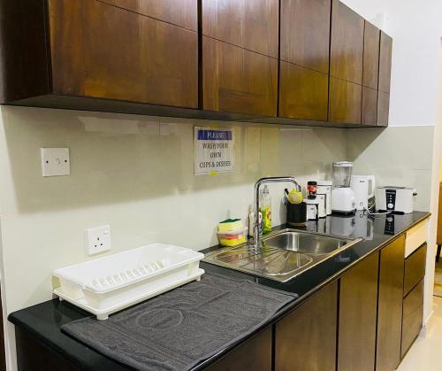 a kitchen with a sink and a counter top at The Luxury Nest in Maharagama