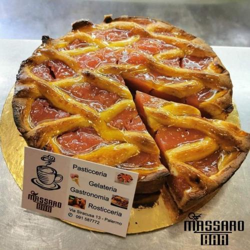 a pizza in a box on a table at B&B Carpe Diem in Palermo