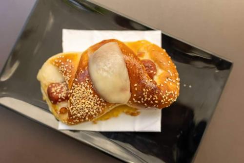 a sandwich sitting on top of a glass plate at B&B Carpe Diem in Palermo