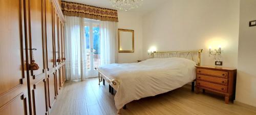 מיטה או מיטות בחדר ב-DolomiApartments - Casa Daria
