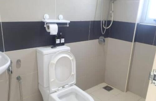 a bathroom with a toilet and a shower at MLH Premier Suites @ Saville Cheras in Cheras