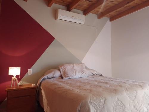 מיטה או מיטות בחדר ב-1780 Alojamiento