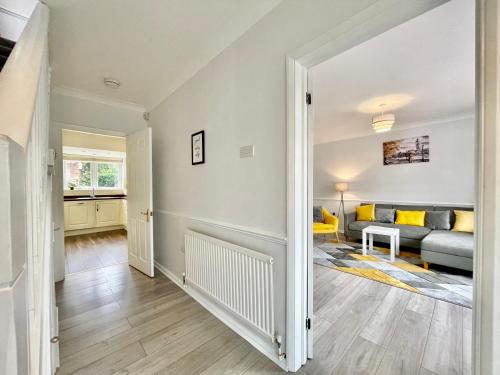 a living room with a couch and a table at Stylish 3 Bed Chigwell Home with Free Parking in Chigwell