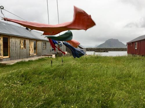 a sculpture of a boat in a field at Villa Lofoten - Edvardbua in Kvalnes