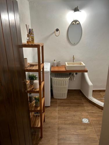 a bathroom with a sink and a mirror at Cretan House Antonis in Kamilari