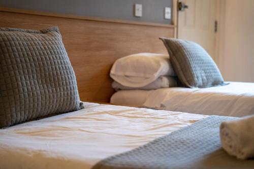 En eller flere senge i et værelse på Winchelsea Lodge