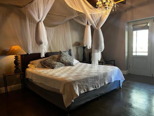 Ένα ή περισσότερα κρεβάτια σε δωμάτιο στο Klipkraal Farm