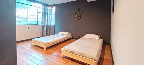 Säng eller sängar i ett rum på Casa Estudio Condesa