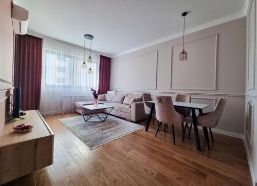 a living room with a couch and a table at Comfort Lux Residence in Banja Luka